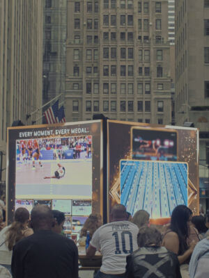 The crowd watching the game.
(EVERY MOMENT.EVERY MEDAL PULISIC,people, many, street, city, drag race, battle, flag signal, rally, business, police, offense, group, landscape, building, university, flag, crowd, education, urban, school)